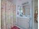 Clean bathroom with shower and a decorative shower curtain at 220 Willow Brook Dr, Leesburg, FL 34748