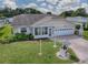 Single-story house with a well-maintained lawn at 220 Willow Brook Dr, Leesburg, FL 34748