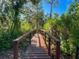 Wooden boardwalk path through lush Florida landscape at 2871 Myakka River Rd, Tavares, FL 32778