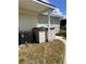 Backyard with AC unit and storage sheds at 34323 Island Dr, Leesburg, FL 34788