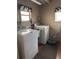 Laundry room with washer, dryer, and utility sink at 34323 Island Dr, Leesburg, FL 34788