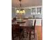 Elegant dining room with a chandelier and built-in cabinetry at 34323 Island Dr, Leesburg, FL 34788