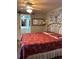 Spacious bedroom with a large bed and ensuite bathroom access at 34323 Island Dr, Leesburg, FL 34788