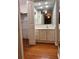 Clean bathroom with a vanity, sink, and large mirror at 34323 Island Dr, Leesburg, FL 34788