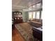 Comfortable living room with large windows and hardwood floors at 34323 Island Dr, Leesburg, FL 34788