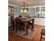 Charming dining room, featuring hardwood floors and a chandelier at 34323 Island Dr, Leesburg, FL 34788