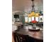 Spacious dining area with hardwood floors and chandelier at 34323 Island Dr, Leesburg, FL 34788