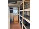 Storage room with shelves for various items at 34323 Island Dr, Leesburg, FL 34788