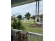 Quaint front porch with a view of the lake and neighborhood at 104 Turtle Run, Umatilla, FL 32784