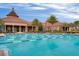 Community pool with a clubhouse in the background at 326 Silver Maple Rd, Groveland, FL 34736