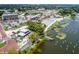 Aerial view of waterfront community with shops and restaurants at 27637 Lisa Dr, Tavares, FL 32778