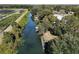 Aerial view showcasing waterfront property with canal access at 27637 Lisa Dr, Tavares, FL 32778