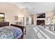Spacious main bedroom with high ceilings, fireplace, and large windows at 39400 French Rd, Lady Lake, FL 32159