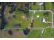 Aerial view of a large property with multiple buildings and pastures at 39400 French Rd, Lady Lake, FL 32159