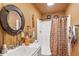 Simple bathroom with a shower, sink, and rustic decor at 39400 French Rd, Lady Lake, FL 32159