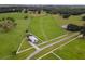 Aerial view of property showcasing a home, expansive fields, and water features at 39400 French Rd, Lady Lake, FL 32159