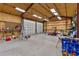 Large workshop with high ceilings, lots of storage, and a large garage door at 39400 French Rd, Lady Lake, FL 32159
