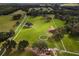 Aerial view of the property showcasing the land and outbuildings at 39400 French Rd, Lady Lake, FL 32159