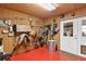 Neat tack room with saddles, bridles, and other equestrian equipment at 39400 French Rd, Lady Lake, FL 32159