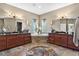 Elegant bathroom featuring a corner soaking tub and dual vanities at 39400 French Rd, Lady Lake, FL 32159