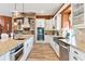 Open concept kitchen with island, stainless steel appliances, and granite countertops at 39400 French Rd, Lady Lake, FL 32159