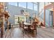 Formal dining room with hardwood floors, stone fireplace and chandelier at 39400 French Rd, Lady Lake, FL 32159