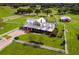 Aerial view of a large home on a spacious lot with outbuildings at 39400 French Rd, Lady Lake, FL 32159