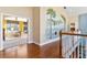 Upstairs hallway with hardwood floors and painted mural at 39400 French Rd, Lady Lake, FL 32159