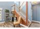 Under-stair wine cellar with mini-fridge and shelving at 39400 French Rd, Lady Lake, FL 32159