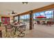 Covered patio with pool view, dining area, and comfortable seating at 39400 French Rd, Lady Lake, FL 32159