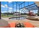 Inviting kidney-shaped pool with spa and screened enclosure at 39400 French Rd, Lady Lake, FL 32159