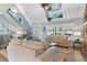 Spacious living room with high ceilings, stone fireplace, and comfortable seating at 39400 French Rd, Lady Lake, FL 32159