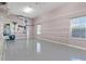 Spacious garage with built-in shelving and overhead storage at 39400 French Rd, Lady Lake, FL 32159