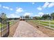 Brick driveway leading to a stunning two-story home at 39400 French Rd, Lady Lake, FL 32159