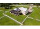 Aerial view of a house with a pool and expansive fenced property at 39400 French Rd, Lady Lake, FL 32159