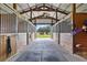 Spacious horse stables with multiple stalls and a view of the property at 39400 French Rd, Lady Lake, FL 32159