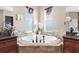 Relaxing bathroom with corner bathtub and dual vanities at 39400 French Rd, Lady Lake, FL 32159