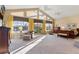 Spacious main bedroom with high ceilings, large windows, and sitting area at 39400 French Rd, Lady Lake, FL 32159