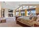 Main bedroom with ample space, high ceilings, and large windows offering scenic views at 39400 French Rd, Lady Lake, FL 32159