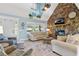 Bright living room with high ceilings, stone fireplace, and plenty of natural light at 39400 French Rd, Lady Lake, FL 32159