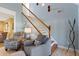 Elegant staircase with wooden railing and soft lighting at 39400 French Rd, Lady Lake, FL 32159
