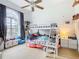 bedroom with bunk beds and ample storage at 139 Belfry Dr, Davenport, FL 33897