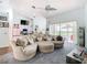Spacious living room with large sectional sofa and view of the pool at 139 Belfry Dr, Davenport, FL 33897