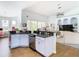 Open kitchen with a large island and breakfast bar overlooking the Gathering room at 139 Belfry Dr, Davenport, FL 33897