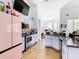 Kitchen with granite countertops, stainless steel appliances, and a pink refrigerator at 139 Belfry Dr, Davenport, FL 33897