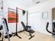 Bright home gym with weight equipment, a bench, and storage at 139 Belfry Dr, Davenport, FL 33897