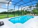 Inviting screened pool with lounge chairs and a view at 139 Belfry Dr, Davenport, FL 33897