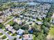 Wide aerial view of the property and surrounding neighborhood at 1302 Oporto Dr, The Villages, FL 32162