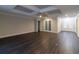 Spacious living room with dark hardwood floors and high ceilings at 38530 Wooded Meadow Drive, Umatilla, FL 32784