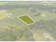 Aerial view highlighting a buildable lot in a serene setting at 38530 Wooded Meadow Drive, Umatilla, FL 32784